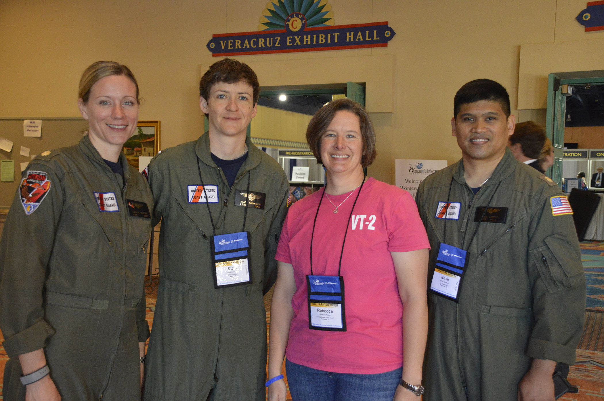 Left: LCDR Breanna Knutson USCG, MH-65 Dolphin pilot, LT Becki Fosha USCG, T-6 Instructor pilot, LTJG Staci Kronberg USCG, C-130 pilot, LCDR Ernie Gameng USCG, C-130 pilot & Avionics Upgrade Transition Team 